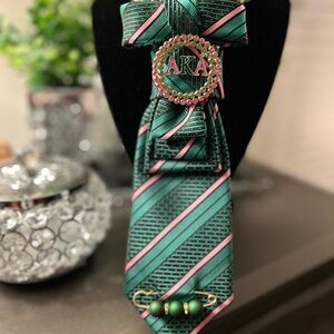 Couture Ties with an elegant sorority brooch.